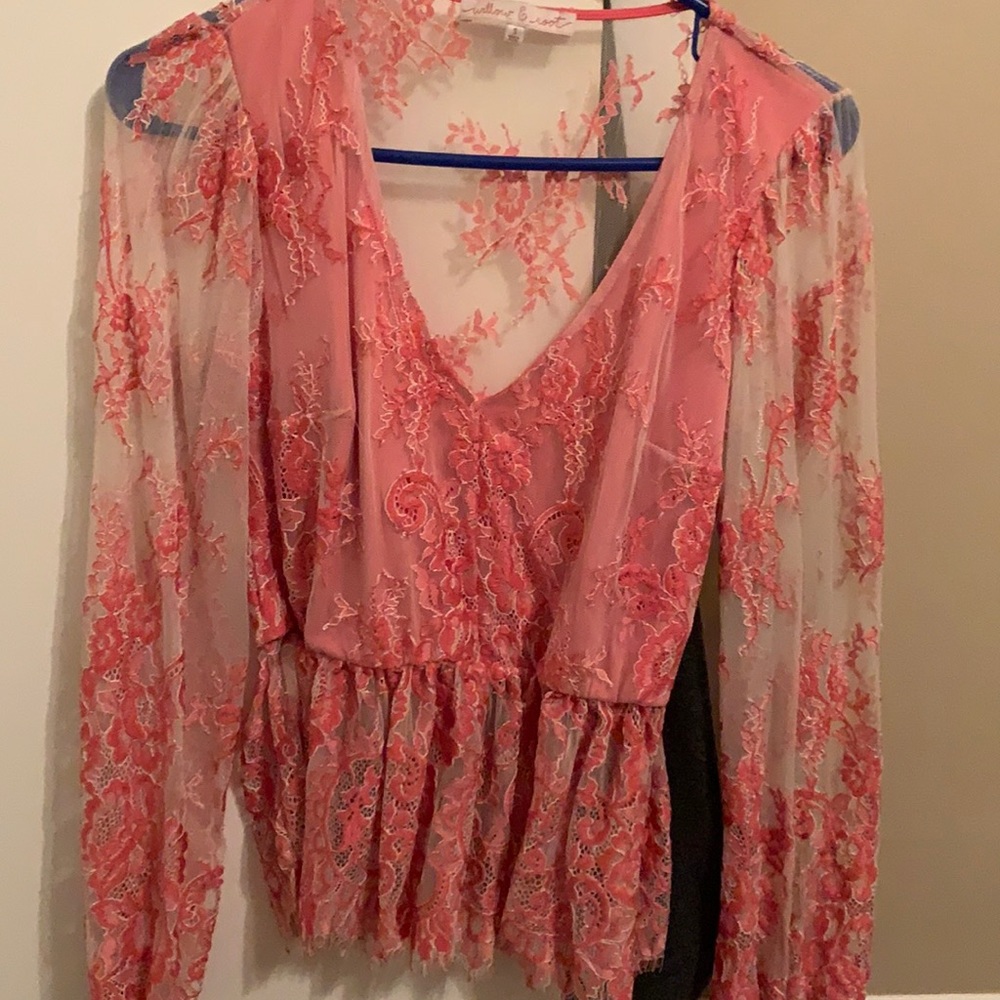 Sheer lace Buckle Top Coral color.